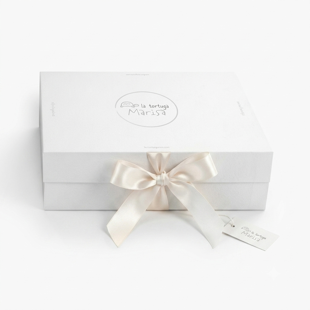 White La Tortuga Marisa gift box finished with a white ribbon.